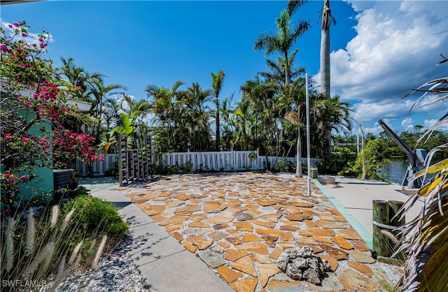 view of patio with a water view