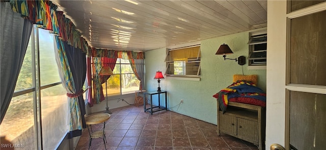 sunroom / solarium featuring wood ceiling