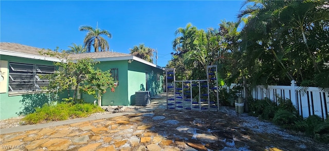 view of side of property featuring cooling unit