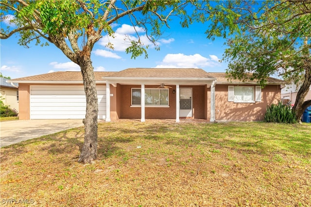 single story home with a front yard, a garage, and ceiling fan