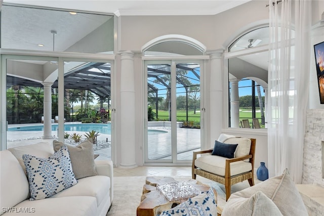 tiled living room with lofted ceiling, a fireplace, and ceiling fan