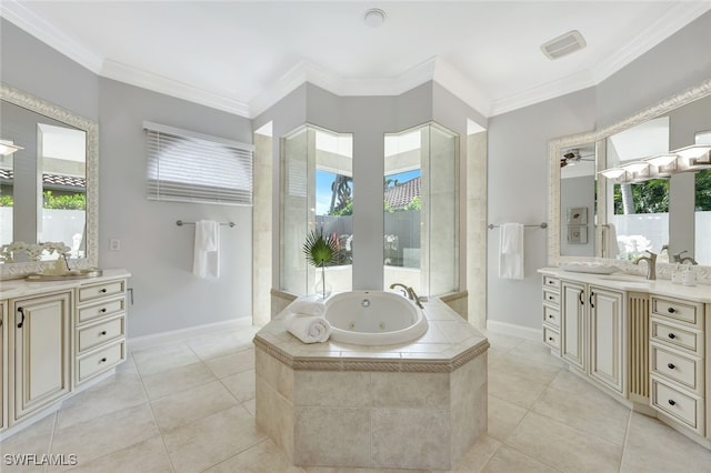 bathroom with ornamental molding, tiled tub, tile patterned floors, and vanity