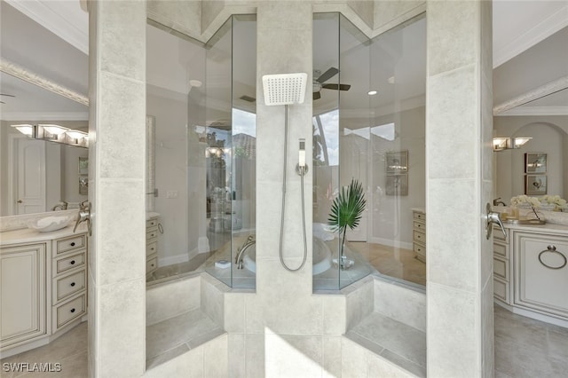 bathroom featuring vanity, a shower with shower door, and ornamental molding