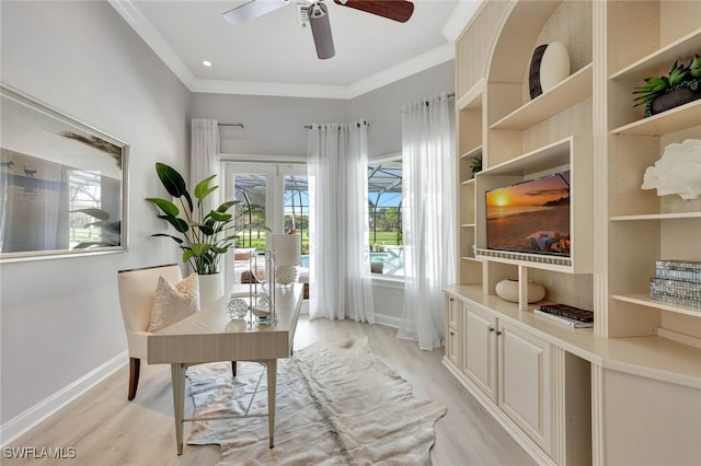 office featuring french doors, light wood-type flooring, ceiling fan, and crown molding