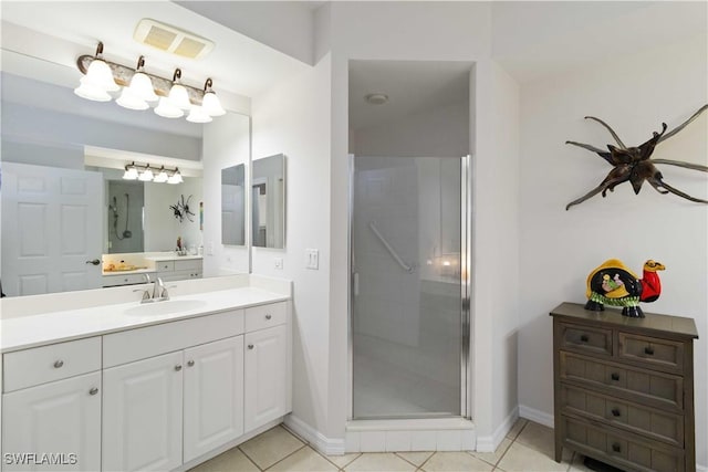 bathroom with vanity, tile patterned floors, and an enclosed shower