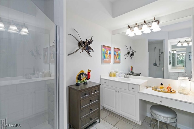 bathroom with tile patterned flooring, vanity, and an enclosed shower