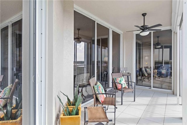 exterior space featuring ceiling fan and a patio