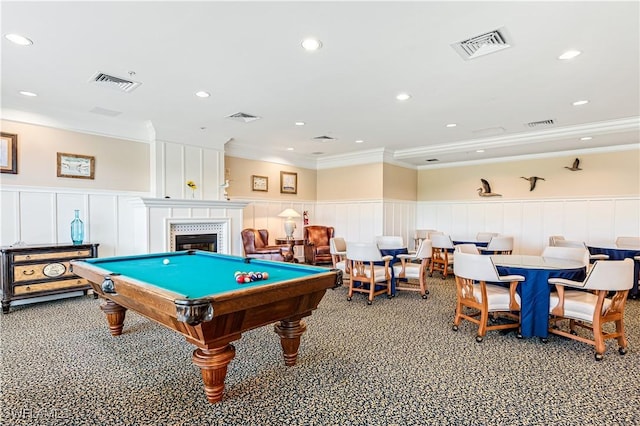 game room with a large fireplace, crown molding, and pool table