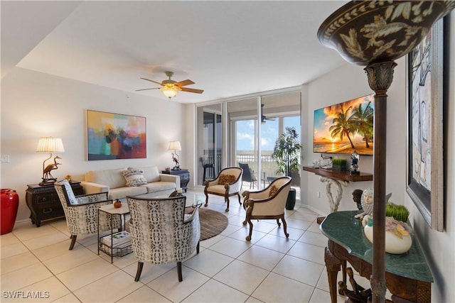 living room featuring ceiling fan, light tile patterned flooring, and floor to ceiling windows