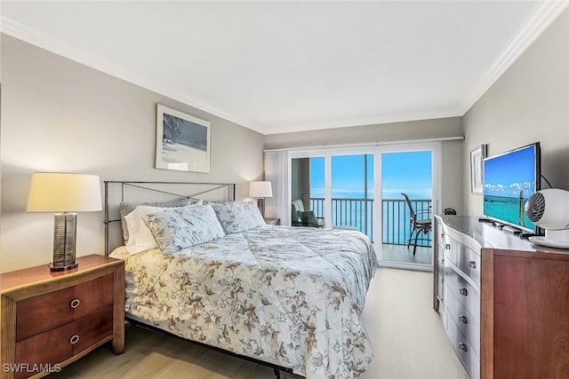 bedroom featuring access to exterior, ornamental molding, and light hardwood / wood-style floors