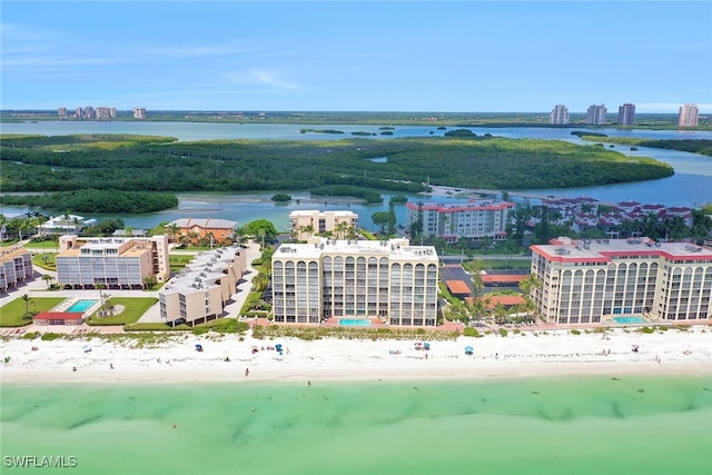 bird's eye view featuring a water view and a view of the beach