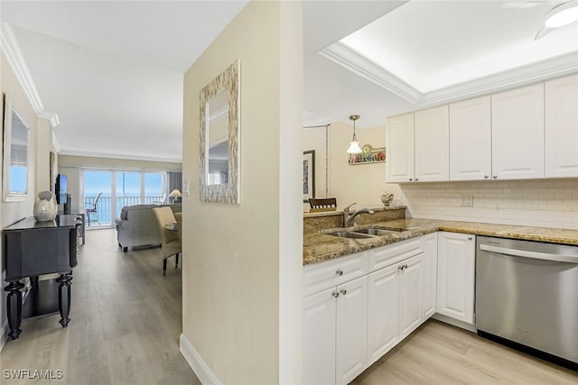 kitchen with hanging light fixtures, white cabinets, dishwasher, and light wood-type flooring