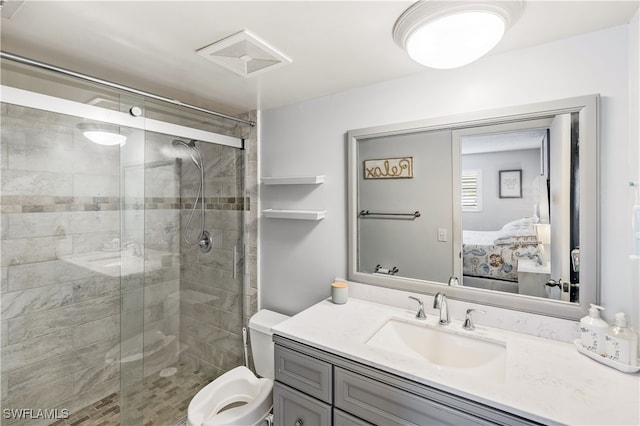 bathroom with toilet, an enclosed shower, and vanity