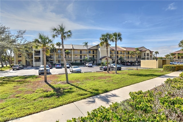 view of home's community with a lawn