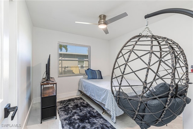 bedroom with light tile patterned floors and ceiling fan