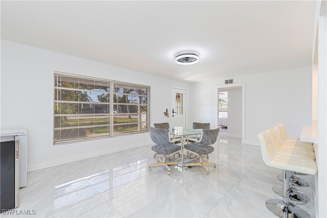 dining room with plenty of natural light