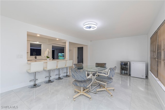 dining room featuring wine cooler