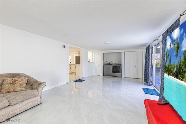 living room featuring washer and dryer