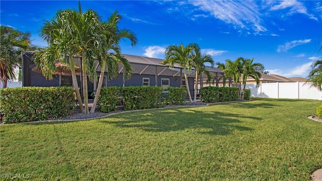 view of yard featuring glass enclosure