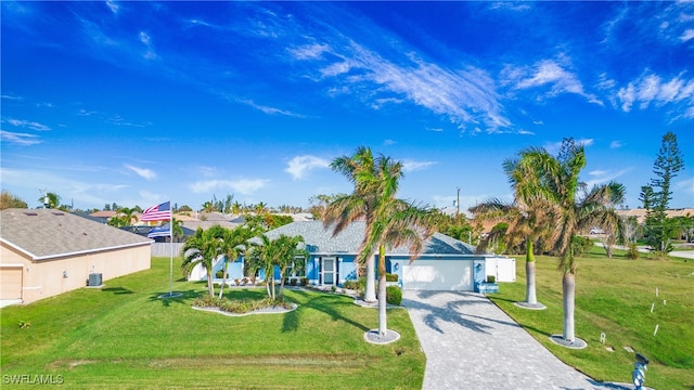 single story home with a garage and a front yard