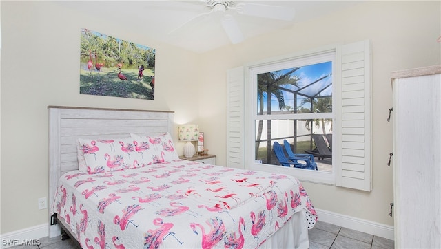 tiled bedroom featuring ceiling fan