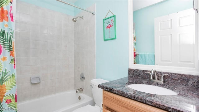 full bathroom featuring toilet, shower / bath combo, and vanity