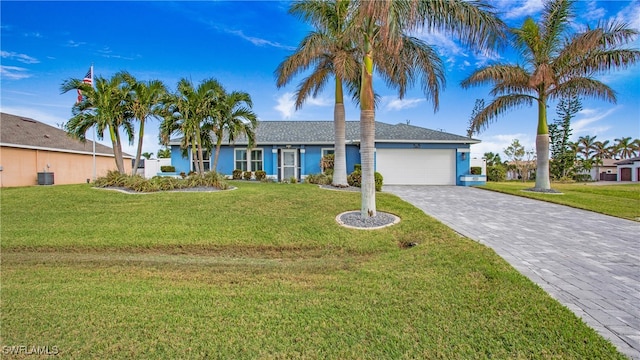 ranch-style home featuring a garage and a front lawn