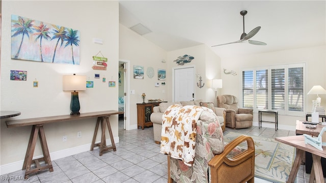 tiled living room with ceiling fan and vaulted ceiling