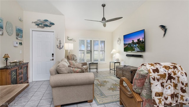 living room with light tile patterned flooring, ceiling fan, and lofted ceiling