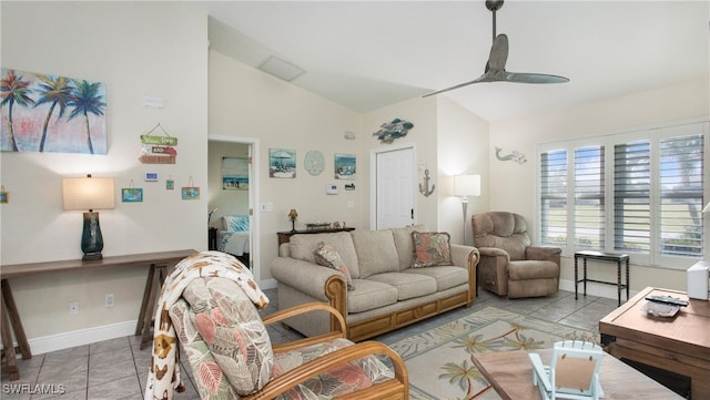 living room with ceiling fan, light tile patterned floors, and lofted ceiling