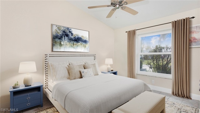 tiled bedroom featuring ceiling fan and vaulted ceiling