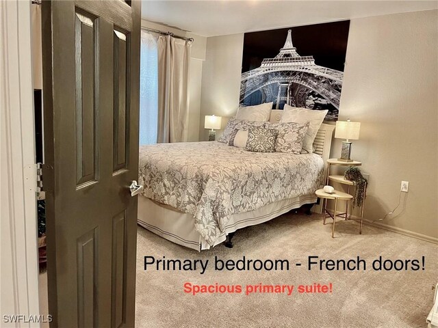 carpeted bedroom with baseboards