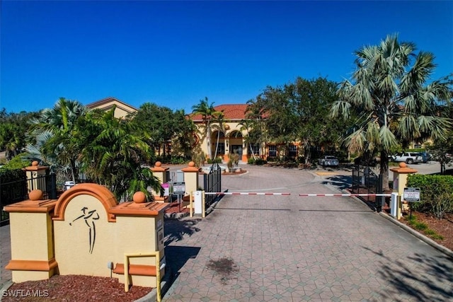 7925 Preserve Cir Unit 333, Naples, FL 34119 - view of street with curbs, a gate, and a gated entry