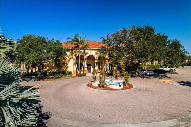 7925 Preserve Cir Unit 333, Naples, FL 34119 - view of property featuring curved driveway