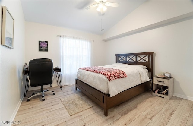 bedroom featuring light hardwood / wood-style flooring, lofted ceiling, and ceiling fan