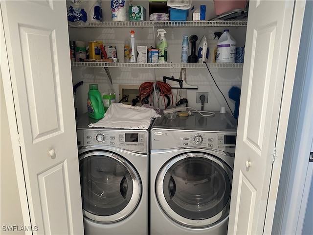 clothes washing area featuring washing machine and clothes dryer