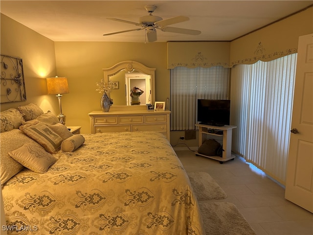 tiled bedroom with ceiling fan