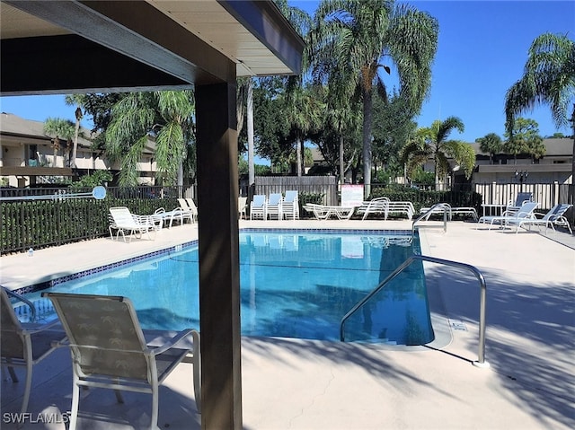 view of swimming pool with a patio