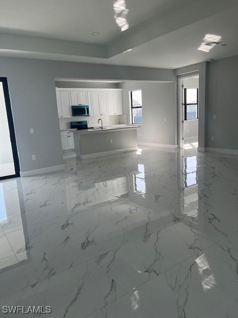 kitchen featuring white cabinets and electric range oven