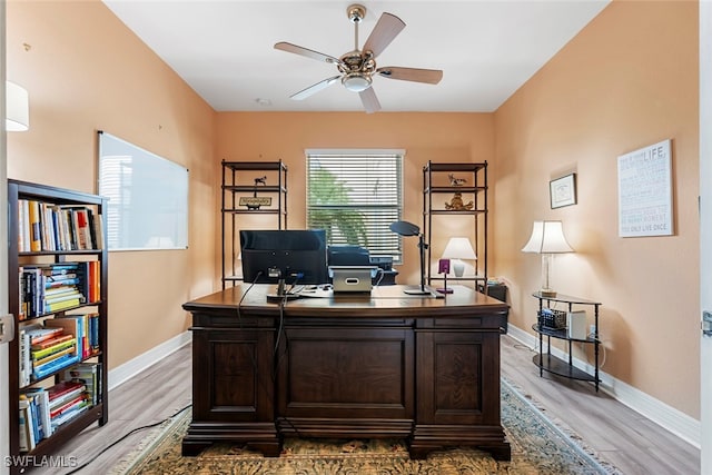 office area with ceiling fan and light hardwood / wood-style flooring