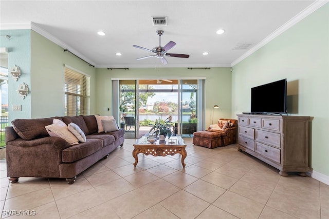 tiled living room featuring ceiling fan and ornamental molding