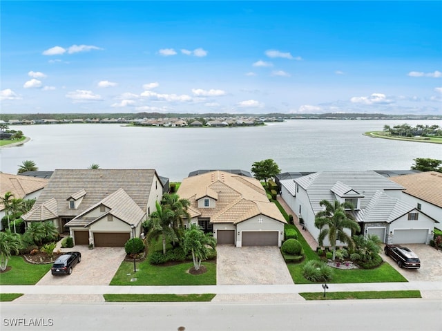 bird's eye view with a residential view and a water view