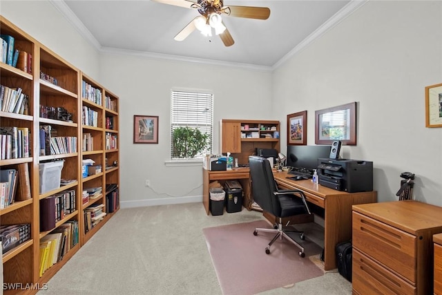 office space featuring light carpet, ceiling fan, baseboards, and crown molding