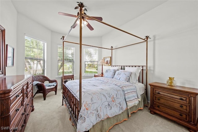 bedroom with light carpet and ceiling fan