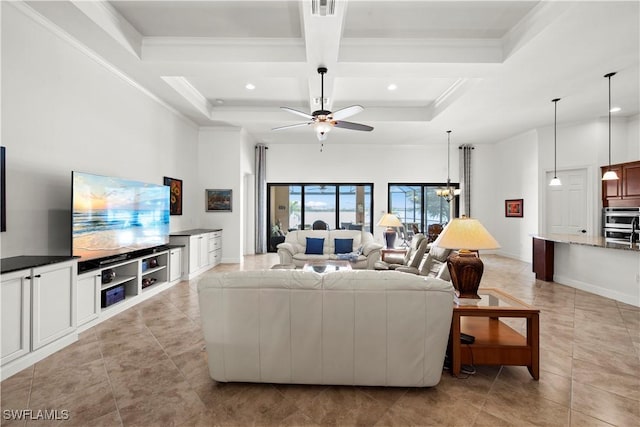 living area featuring a high ceiling, ornamental molding, coffered ceiling, and beamed ceiling