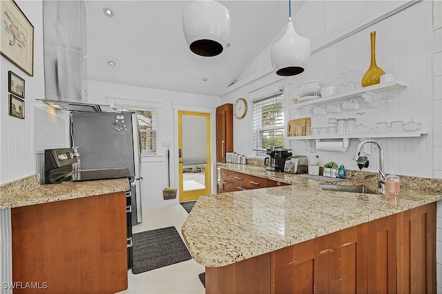 kitchen with hanging light fixtures, kitchen peninsula, black / electric stove, and sink