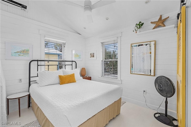 bedroom featuring multiple windows, ceiling fan, and lofted ceiling