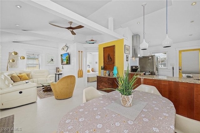 dining space with lofted ceiling with beams and ceiling fan