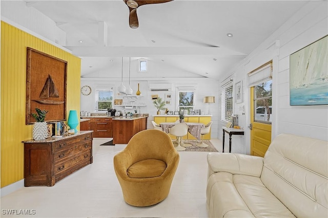 living room with vaulted ceiling with beams, ceiling fan, and an AC wall unit