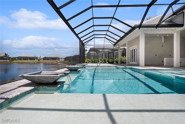 view of pool featuring pool water feature, a patio, glass enclosure, and a jacuzzi